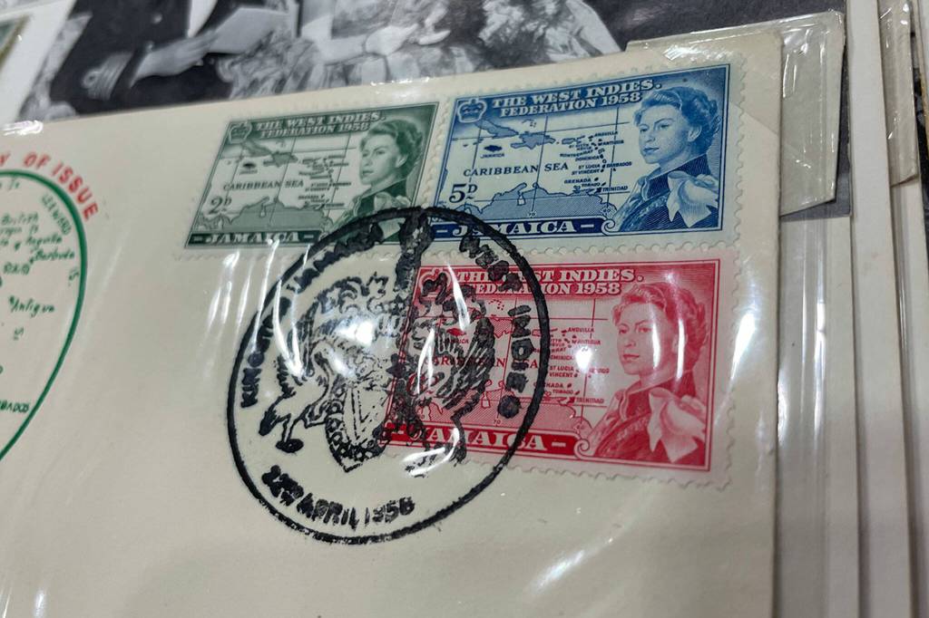 Sequim Gazette photo by Matthew Nash/ Stamps in Phil Castells collection show Queen Elizabeth IIs travels across the globe through stamps, including Jamaica.