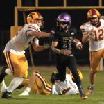 Sequim Gazette photo by Michael Dashiell / Sequims Sam Fitzgerald breaks through the Kingston defense for a big gain in the Wolves 27-13 Homecoming victory on Sept. 30.