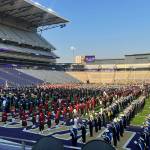 Submitted photo/ Sequim High and Middle School students rehearse for the halftime show of the University of Washingtons football game on Sept. 10 with more than 2,000 other students from across Washington.
