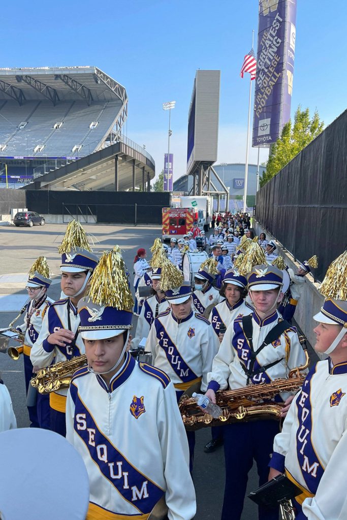 Submitted photo/ Sequim High and Middle School students line up for the halftime show rehearsal for the University of Washingtons football game on Sept. 10 with more than 2,000 other students from across Washington.