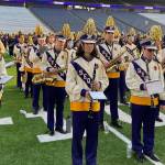 Submitted photo/ Sequim High and Middle School students rehearse for the halftime show of the University of Washingtons football game on Sept. 10 with more than 2,000 other students from across Washington.