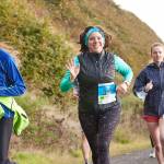 Photo courtesy of Run the Peninsula / Adrienne Lopata, center, is all smiles at the Larry Scott Trail 5k in 2021.