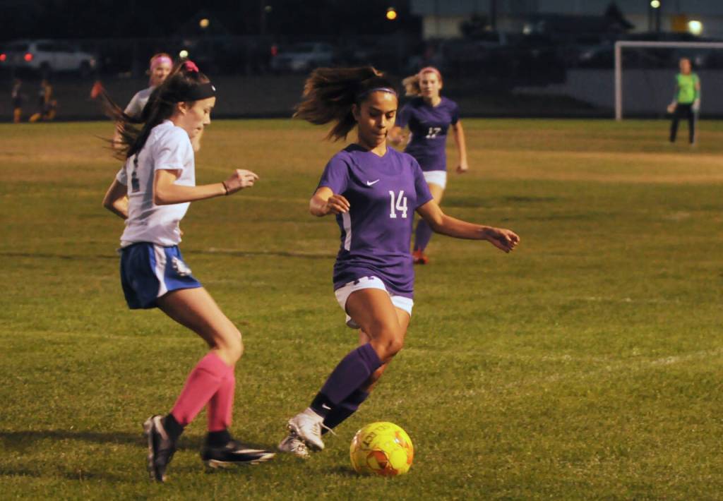 Sequim Gazette photo by Michael Dashiell
Sequims Alex Salas, right, maintains possession in the first half of Sequims 11-1 win over the visiting North Mason Bulldogs on Oct. 6. After a couple of near scores, Salas had a long, left-footed score that put Sequim up 3-1 in the first half.