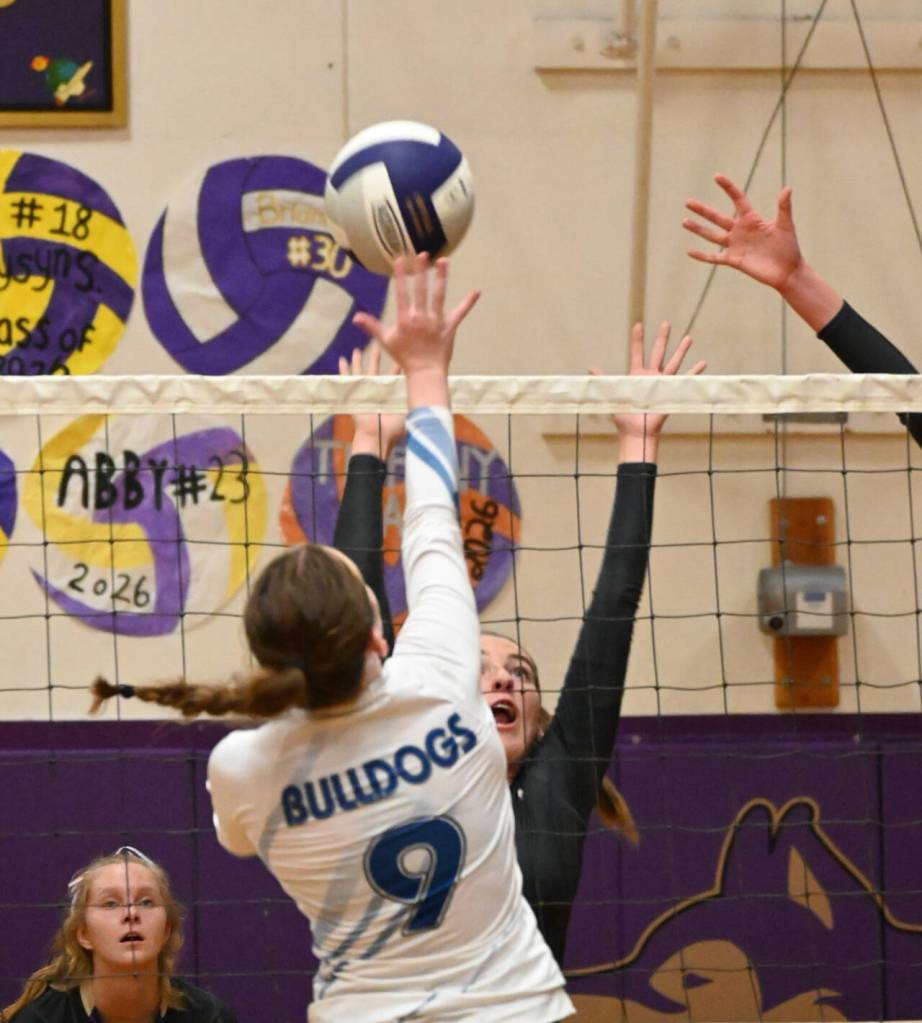 Sequim Gazette photo by Michael Dashiell / With teammate Jolene Vaara, left, looking on, Sequims Sydney Clark looks to block a shot by North Masons Teegan Skjonsby in an Olympic League match on Sept. 6. Sequim won, 3-1.