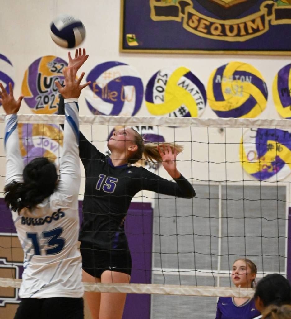 Sequim Gazette photo by Michael Dashiell / With teammate Mia Coudriet, right, looking on, Sequims Kendall Hastings looks to hit a ball past North Masons Adrianna Tupolo in the Wolves four-set home win on Sept. 6.