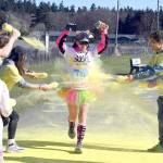 Michael Dashiell/Sequim Gazette
Tiffanie Powless gets a splash of yellow at the last color station at the Sun Fun Color Run 5k at the Albert Haller Playfields just north of Carrie Blake Community Park in March. Registration for the 2023 race opened recently, with early bird pricing available through Oct. 31.