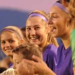 Sequim Gazette photos by Michael Dashiell
Taryn Johnson, center, and teammates  joined by Sequim Junior Soccer players  are introduced before their Olympic League match-up with North Mason on Oct. 6. Johnson set the SHS girls soccer programs record for career goals.