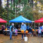 Photo by Amy McIntyre / Community members take part in a pumpkin carving contest at the Port Angeles Fine Arts Center in 2021.