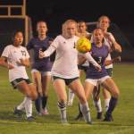 Michael Dashiell/Sequim Gazette
Port Angeles Paige Mason, center looks to control the ball as, from left, Port Angeles Lily Sanders (10) and Sequims Teagen Moore (6) and Taryn Johnson (3) look on in an Olympic League match on Oct. 11. Port Angeles edged their rivals, 3-2.