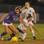Sequim Gazette photo by Michael Dashiell / Sequims Jennyfer Gomez vies for the ball with Port Angeles Piper Williams as Rider Becca Manson looks on in the Roughriders 3-2 win in Sequim on Oct. 11.