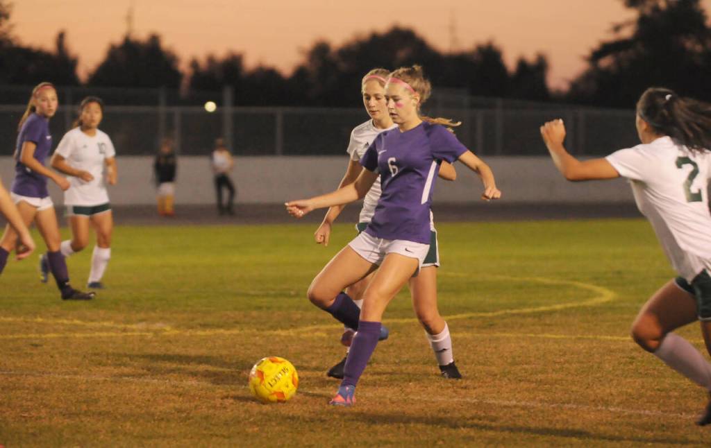 Sequim Gazette photo by Michael Dashiell / Sequims Teagen Moore looks for a teammate as Port Angeles Becca Manson gives chase in a 3-2 PA win in Sequim on Oct. 11.