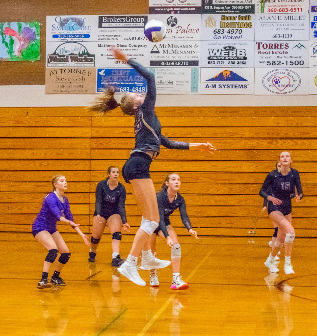 Emily Matthiessen/Sequim Gazette
Sequims Jolene Vaara winds up for a spike in the Wolves home win over Bainbridge on Oct. 20. Looking on are, from left, Mia Coudriet, Sydney Hastings, Sydney Clark and Kendall Hastings.