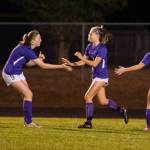Sequim Gazette photo by Emily Matthiessen / Sequim teammates celebrate a Taryn Johnson score in the Wolves 5-3 home loss to the 3A Bainbridge Spartans on Oct. 20.