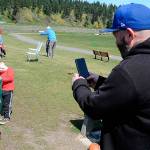 Sequim Gazette photo by Matthew Nash
Terry Wopperer snaps a photo of his son Bentleys first fish at the Kids Fishing Day in April 2022. The event will continue in April 2023 but fish will only be stocked that weekend due to concerns over warm pond temperatures.