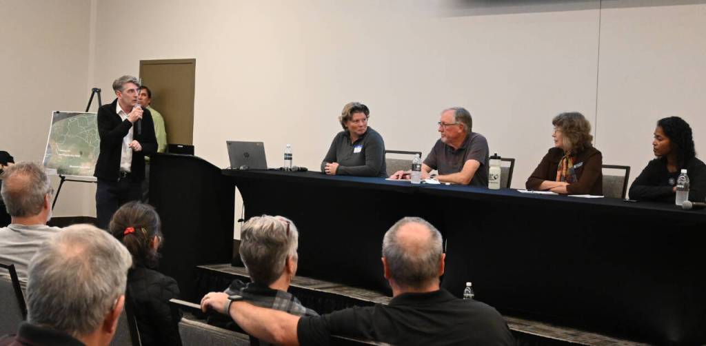 Sequim Gazette photo by Michael Dashiell / At left, Michael Hankinson, a parks planner with Washington State Parks and Recreation Commission, speaks at an Oct. 8 public meeting regarding development of Miller Peninsula State Park. Pictured, from left, are: Diana Dupuis, Washington State Parks and Recreation Commission director; and State Parks commissioners Ken Bounds, Holly Williams and Sophia Danenberg.