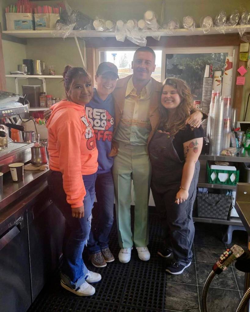 Photo courtesy Kaylee Taylor
Staff with Reddog Coffee Co. stand for a photo with Seattle rapper Macklemore on Oct. 19. They asked for a photo, and he agreed only if he could take it from inside the coffee stand. Pictured, from left, are Paolo Villegas, Kaylee Taylor, Macklemore, and Mazie Whitteker.