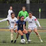 Sequim Gazette photo by Michael Dashiell / Peninsulas Maylin Rivera, left, and Kira Meechudhone vie for the ball against Bellevues Samantha Corrales in the second half of a 6-0 PC home win on Oct. 26.