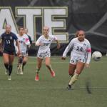 Sequim Gazette photo by Michael Dashiell / Peninsulas Kiarra Scheib (28) advances the ball downfield in the second half of a 6-0 PC win over visiting Bellevue on oct. 26. Looking on are teammates Hannah Wagner (22), a Sequim High grad, and Kira Meechudhone (19).
