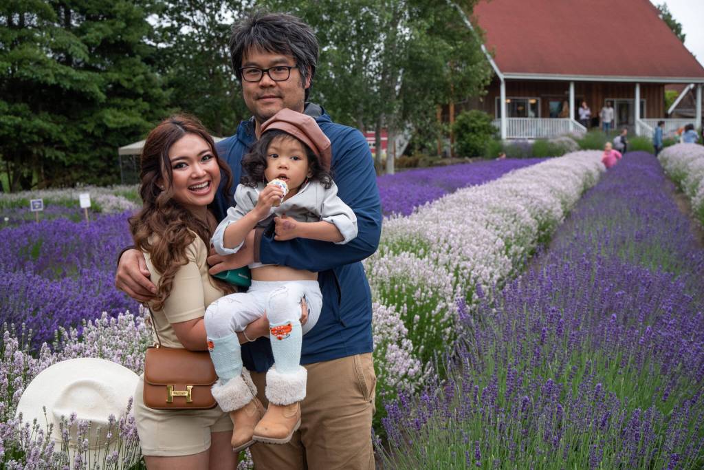 Sequim Gazette photo by Emily Matthiessen / At Purple Haze Lavender Farm on Saturday, Chanbopharoat Neak Phou, Ponloue Phou (with Alyssa Neak Phou, age 3) said they enjoyed past visits to Sequim for the Lavender Festival so much that they came again this year.