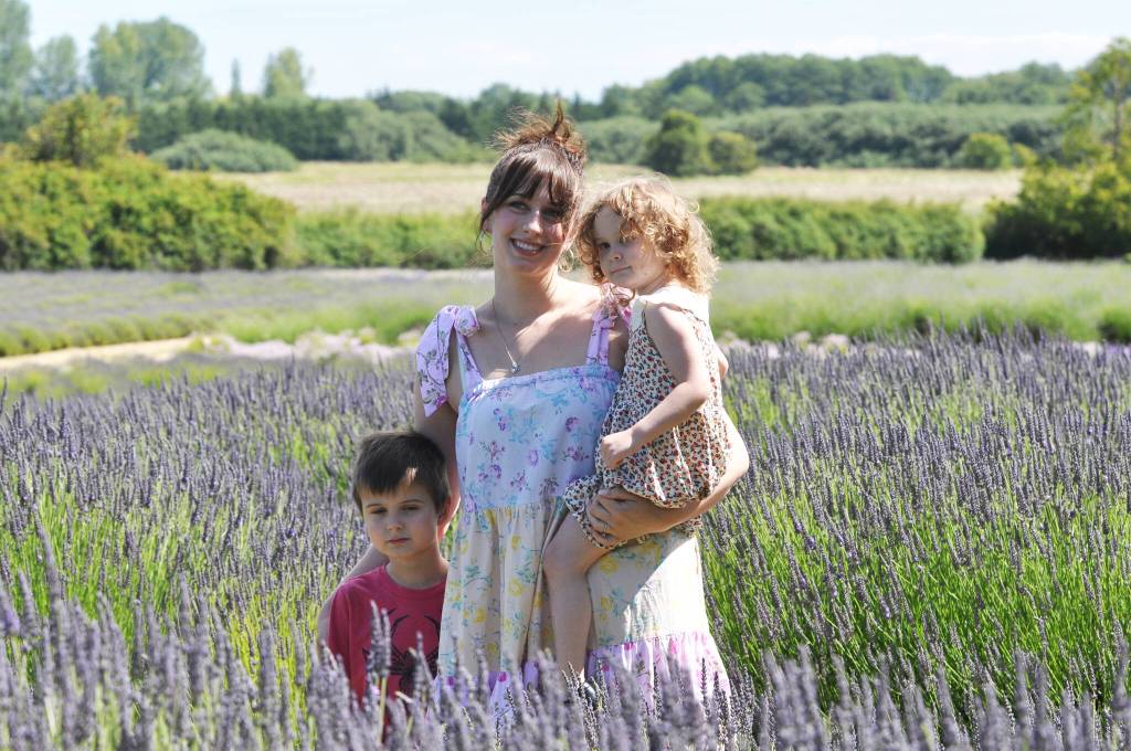 Sequim Gazette photo by Michael Dashiell / Michael Mangiameli, with Sebastian, 5, and Eleanora, 2, of Sequim enjoy a day at Jardin du Soliel Lavender Farm & Gift Shop on July 15.