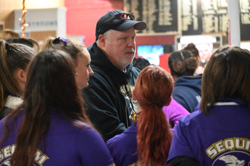 SEQUIM GAZETTE PHOTOS BY Michael Dashiell
Randy Perry, Sequim Highs girls bowling team coach, talks with his squad before a home match against Bremerton at Port Angeles Laurel Lanes on Nov. 10.