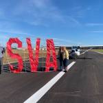 Submitted photo / Sequim Valley Airport owners Andy and Jane Sallee and Emily Westcott on Oct. 5 celebrate the completion of a project to rehabilitate, pave and restripe the airport runway.