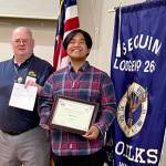 Submitted photo / Sequim High School sophomore Mark Dulfo accepts his October 2022 Student of the Month honor from Jim Headley, Elks Secretary and Past Exalted Ruler.