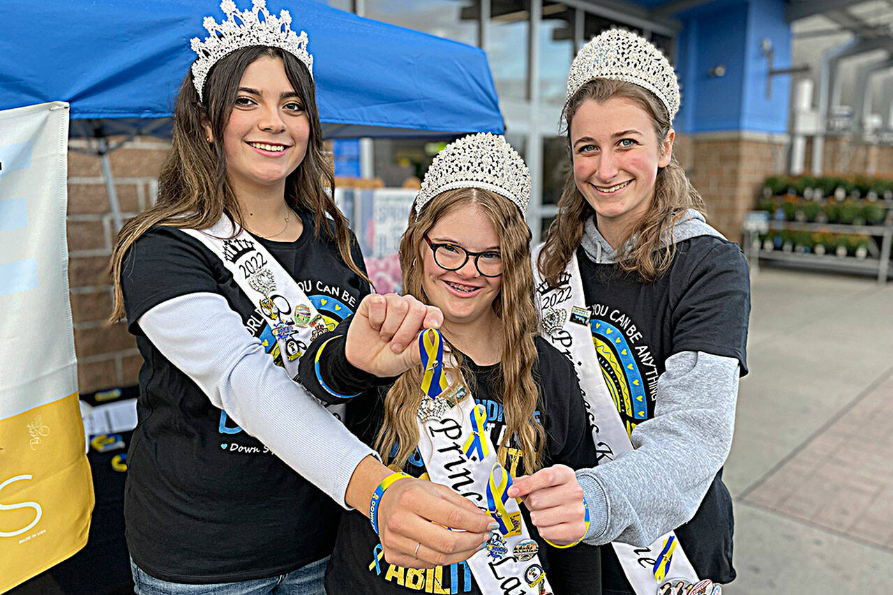 Matthew Nash/SEQUIM GAZETTE
Sequim Irrigation Festival royalty, from left, queen Isabella Williams, princess Lauren Willis, and princess Katherine Gould helped promote Down syndrome Awareness Month on Oct. 20 in front of Sequim Walmart. The effort was part of Willis platform for being on royalty.
