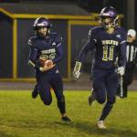 Sequim Gazette photo by Michael Dashiell / Sequims Sam Fitzgerald, left, looks for running room as Aiden Gockerell looks to provide a block in the Wolves season-finale against Bremerton on oct. 28. Fitzgerald had three first half touchdowns.