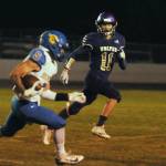 Sequim Gazette photo by Michael Dashiell / Sequims Aiden Gockerell looks to bring down Bremerton running back Jayden Quenga in the first half of the Wolves league match-up with the Knights on Oct. 28.