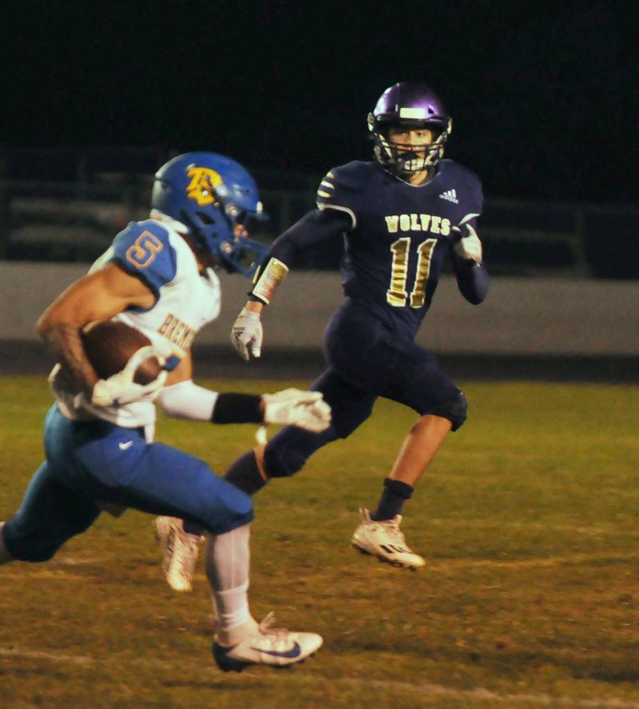 Sequim Gazette photo by Michael Dashiell / Sequims Aiden Gockerell looks to bring down Bremerton running back Jayden Quenga in the first half of the Wolves league match-up with the Knights on Oct. 28.