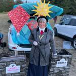 Sequim Gazette photo by Matthew Nash/ Along with pumpkins, cookies and hot dogs, visitors to the Sequim Prairie Grange could visit various themed-trunks, including Heather Ceruttis version of Mary Poppins, for candy. Other trunks ranged from an Elvis-theme to Jurassic Park.