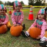 Sequim Gazette photo by Matthew Nash
The Paw Patrols Liberty dog was on the scene in triple time at the Sequim Prairie Granges Trunk-or-Treat on Oct. 29 with, from left, Madalyn, 3-and-a-half, and Jordyn Robotkay, 2-and-a-half, and Oakley Seimer, 3, all of Sequim. The trio all received pumpkins from the grange and their moms planned to take them home to carve. See more pre-Halloween photos on A-11.