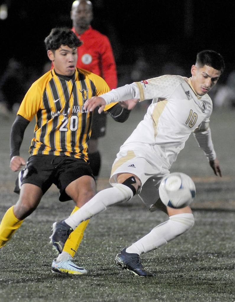 Photo by Keith Thorpe/Olympic Peninsula News Group / Peninsulas Fernando Tavares keeps the ball away from Walla Wallas Nathan Alvarado during a Nov. 5 NWAC semifinal match at Peninsula College in Port Angeles.
