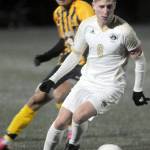 Photo by Keith Thorpe/Olympic Peninsula News Group / Peninsulas Tim Deser drives across the pitch followed by Walla Wallas Julio Tapia on Nov. 5 in Port Angeles.