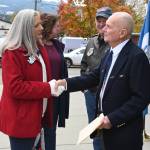 Sequim Gazette photo by Michael Dashiell / Judy Tordini, Regent for the Daughter of the American Revolution-Michael Trebert Chapter, speaks with Col. Tom Johnson (U.S. Marine Corps, ret.) following Friday morning's Veterans Day Ceremony at the Sequim Civic Center plaza.