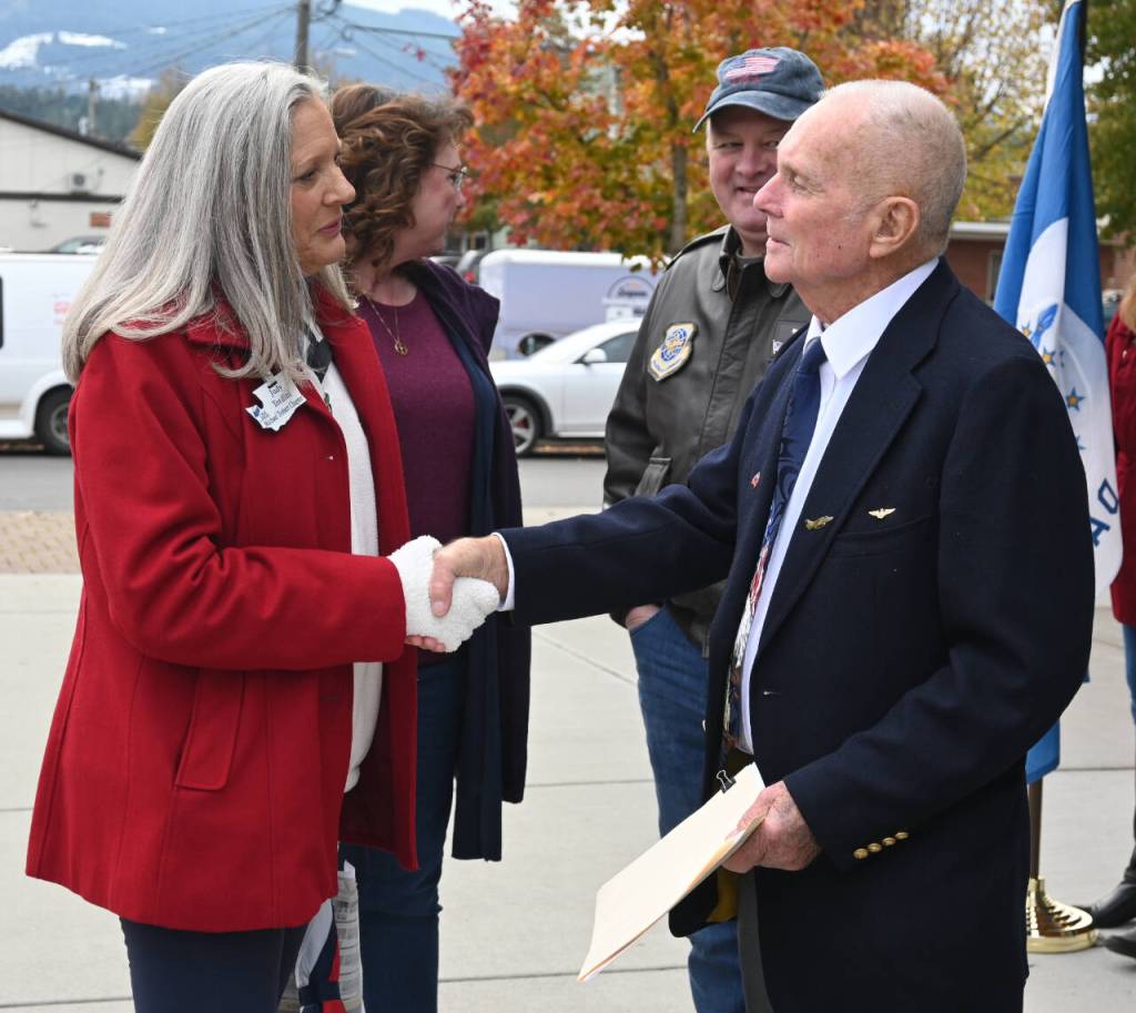 Sequim Gazette photo by Michael Dashiell / Judy Tordini, Regent for the Daughter of the American Revolution-Michael Trebert Chapter, speaks with Col. Tom Johnson (U.S. Marine Corps, ret.) following Friday morning's Veterans Day Ceremony at the Sequim Civic Center plaza.