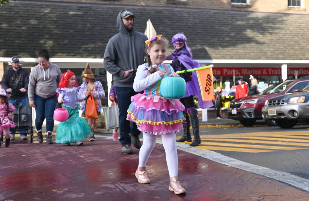 Sequim Gazette photo by Michael Dashiell / Brielle Gleason, 6, joins the hordes of Halloween revelers in downtown Sequim on Halloween, Oct. 31, as local businesses and the Sequim-Dungeness Valley Chamber of Commerce host trick-or-treating after a two-year hiatus.