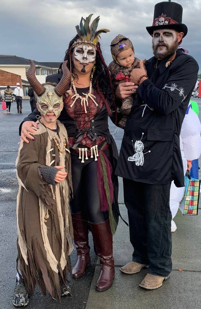Submitted photo / Charlie and Tanya Duerr, pictured here with son Levi, 9, and 7-month-old voodoo doll Lyla, enjoy Halloween festivities in Sequim.
