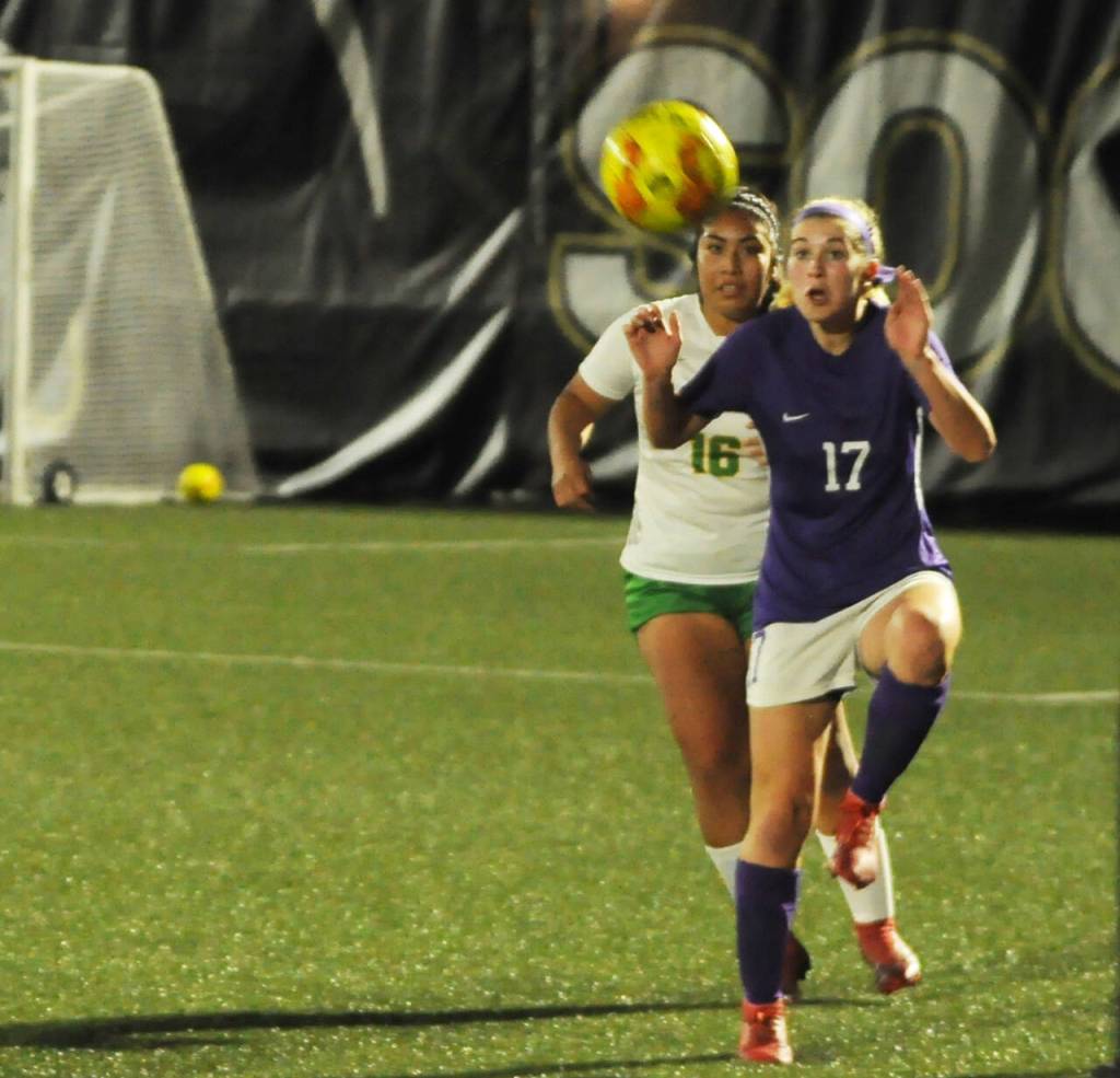 Sequim Gazette photo by Michael Dashiell / Sequim defender Kaia Lestage, right, looks to control the ball with Clover Parks Selena Corona Hernandez nearby, in the Wolves 2-0 West Central District tourney opening win on Nov. 1 in Port Angeles.