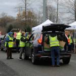 Sequim Gazette file photo by Matthew Nash
Volunteers at last Novembers Holiday Meal Bag Distribution day stock up vehicles as they drive through Carrie Blake Community Park. The event is held again 11 a.m.-2 p.m. Friday, Nov. 18, and Dec. 16.