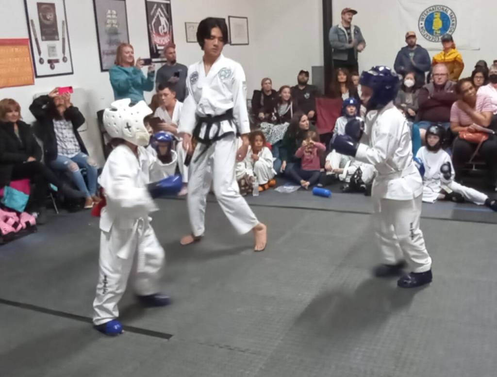 Henrick Bess, left, of Bodystrong Taekwon-do Academy, participates in a friendly tournament training competition in Blyn on Oct. 22.