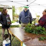 Submitted photo / Tuttie Peetz, right, brings her wreath-making equipment and piles of greens, cones and ribbons to the River Center Holiday Nature Mart this weekend. This sale of hand-crafted items, holiday wreaths and arrangements, and baked goods and candy, set for Nov. 19-20, support the Dungeness River Nature Center’s education programs.