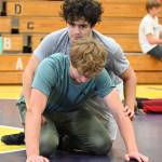Sequim Gazette PHOTO BY Michael Dashiell
Aaron Tolberd, top, and Ari Skov work on a move at a wrestling camp in Sequim in July.