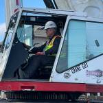 Sequim Gazette photo by Matthew Nash/ Dan Goettling with Accurate Angle Crane focuses on placing the downtown Sequim Christmas tree into position on Nov. 15.