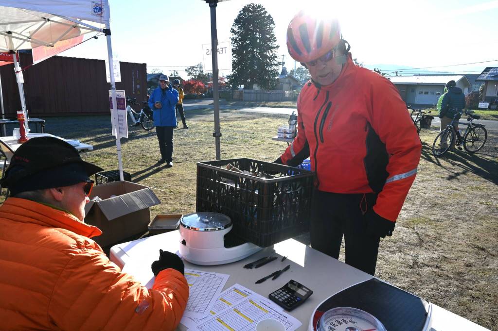 Sequim Gazette photo by Michael Dashiell / Doug Kruth helps his 3 Crabs team bring in the most of any teams in Sequims 2022 Cranksgiving event on Nov. 19.