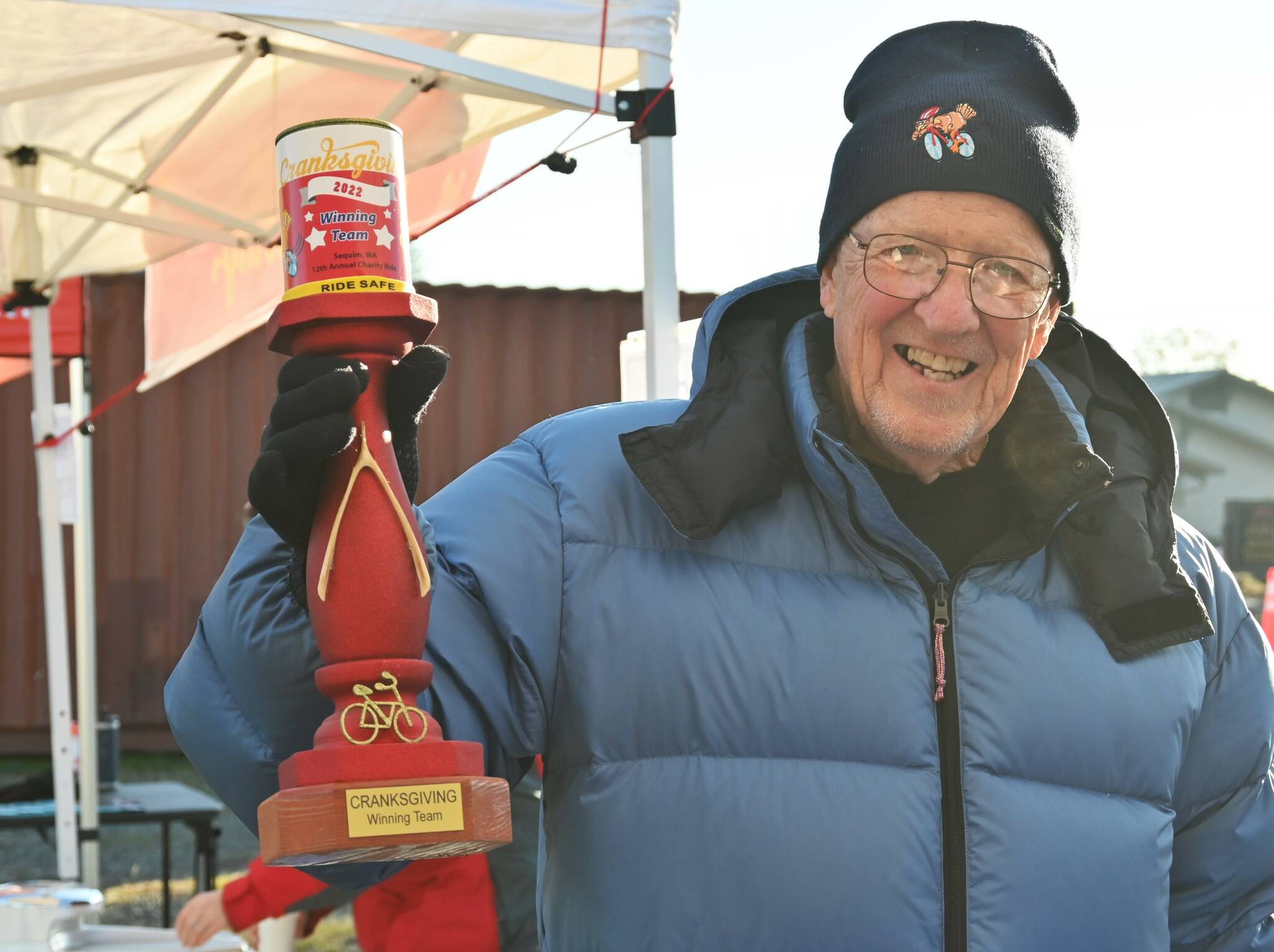 Sequim Gazette photo by Michael Dashiell / Event organizer Tom Coonelly shows off the top team trophy for the 2022 Cranksgiving event on Nov. 19.