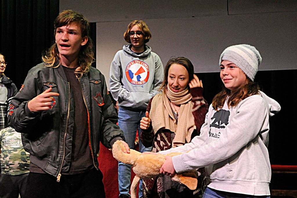 Sequim Gazette photo by Matthew Nash/ Donovan Rynearson asks a question to his directors during a scene of The Best Christmas Pageant Ever at Olympic Theatre Arts as Georgia Bullard, Shannon Bertucci and Emerson Jacobs listen in.