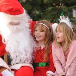 Above: Silver Newell, center, and Lucy Johnson, both 5-year-olds from Sequim, talk with Santa Claus (Stephen Rosales) at the Hometown Holidays event Saturday afternoon in downtown Sequim. The pair are best friends from preschool.