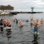 File photo by Keith Thorpe/Olympic Peninsula News Group Polar bear dippers wade in and out of the chilly water at Hollywood Beach in Port Angeles during Saturdays annual New Years Day plunge in January 2022. This years dip is the 11th year the event serves as a fundraiser for Volunteer Hospice of Clallam County.